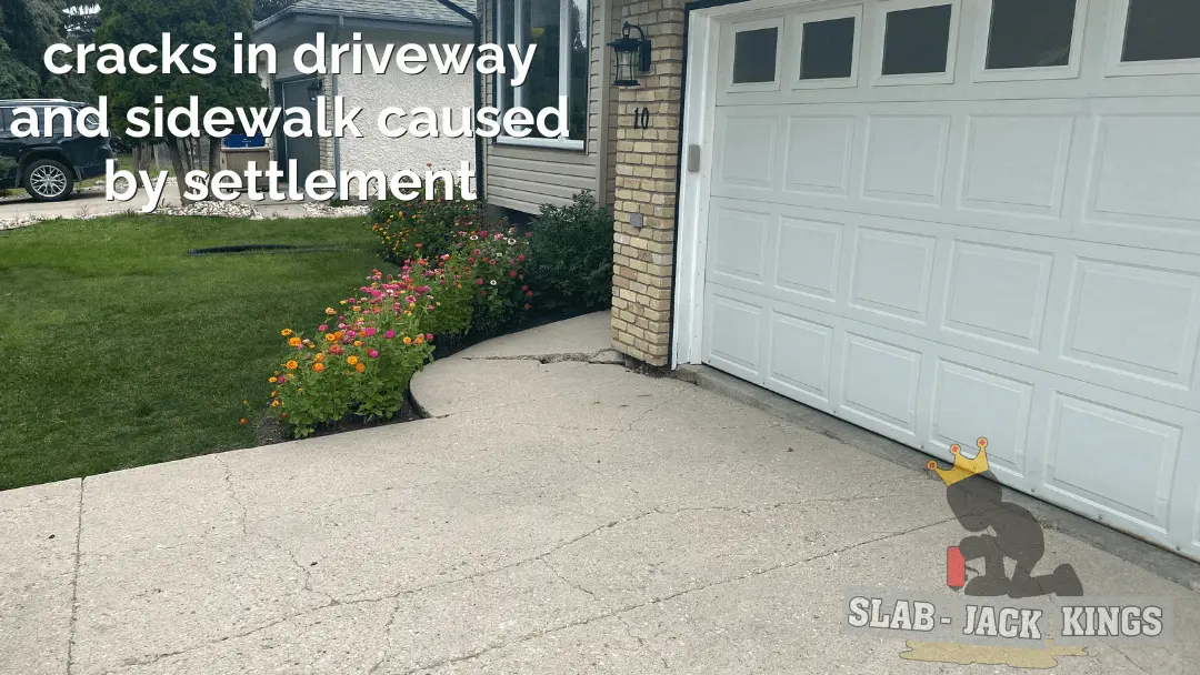 cracks in driveway and sidewalk caused by settlement